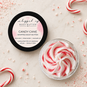 Creamy Candy Cane Whipped Body Butter by My Store, showing the smooth, fluffy texture in a jar with festive design.