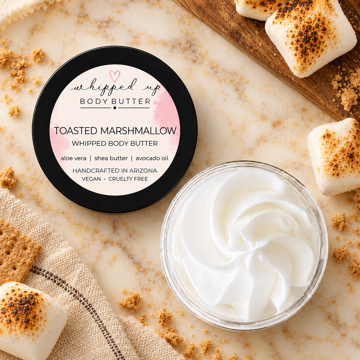 Whipped toasted marshmallow body butter by My Store, showing creamy, fluffy texture in a jar with toasted marshmallow scent